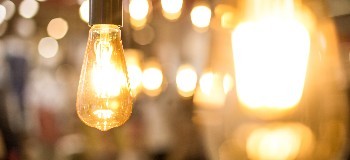 Close up image of lit up Edison style light bulbs.