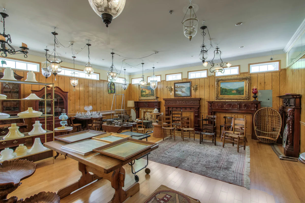 Images of lamp shades, frames, and other antiques Inside Antique Lamp Supply shop.