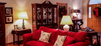 Image of a living room with antique lighting. 