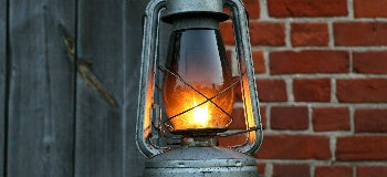 Image of a vintage Kerosene style lamp light up.
