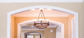 Image of chandelier hanging in house.